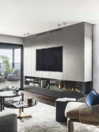 Three-sided Gas Fireplace in well designed living room