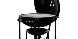 The enormous capacity of the Ranch Kettle charcoal barbecue sets the tone for a party that lasts until tomorrow.